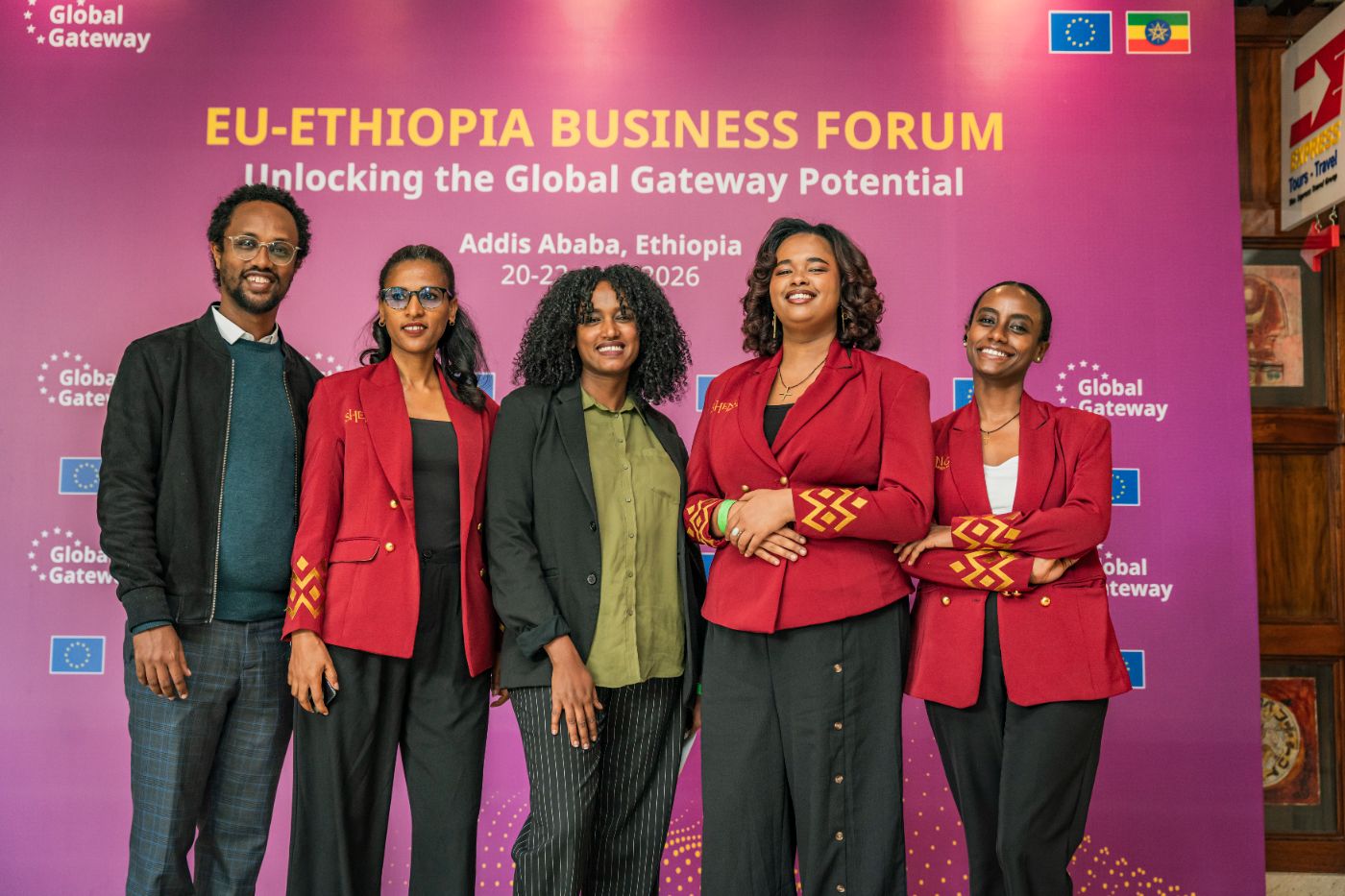 Hosting team at the forum backdrop