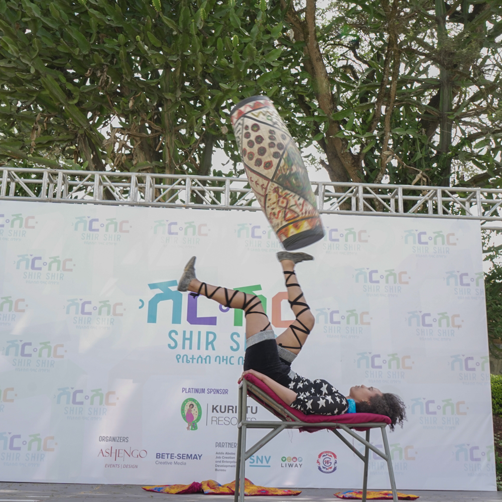 Shir Shir Bazaar — acrobat balancing a drum during the stage programme
