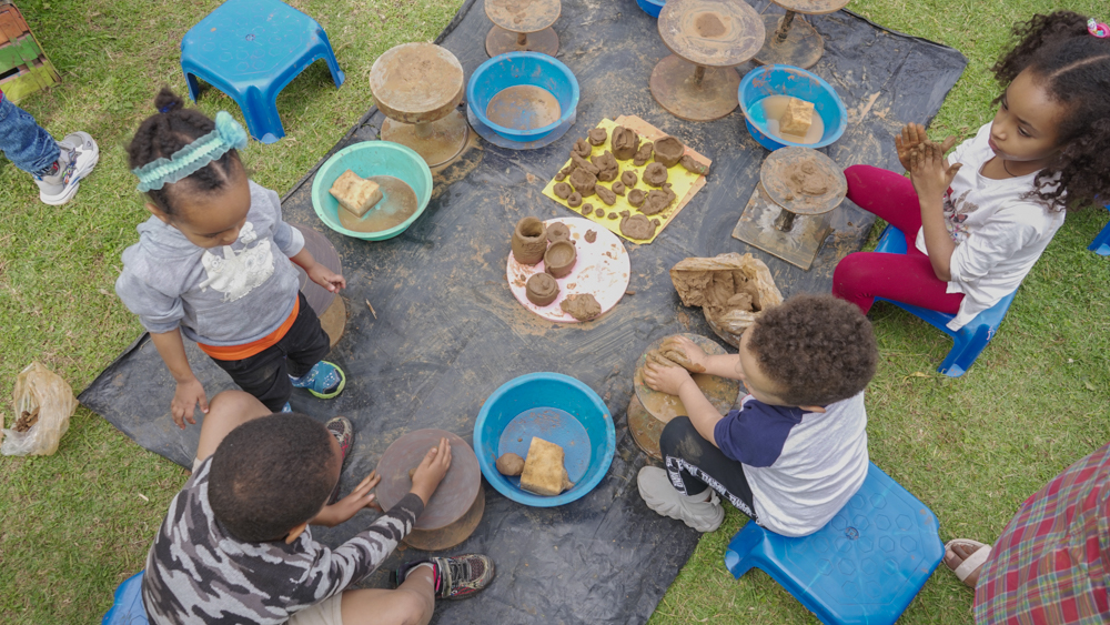 Shir Shir Bazaar — children at the pottery table in the kids’ corner