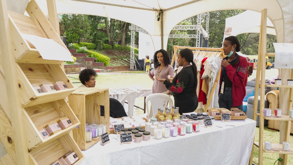 Shir Shir Bazaar — a candle and skincare maker with customers at her stand