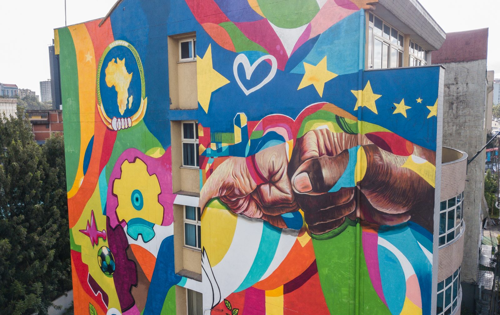 Street Heart — full building façade mural, ground to roofline